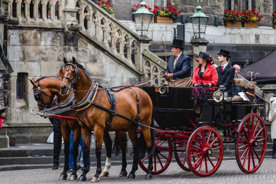 Two-horse carriage with traditional black and red coach at the presentation of the carriages on the market square in Aachen