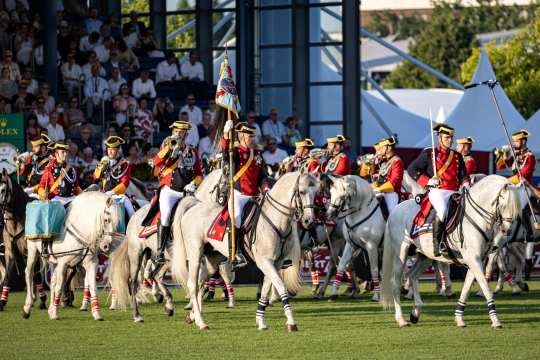 At the opening ceremony, many white horses from the Royal Spanish Riding School perform a show in the form of a quadrille.